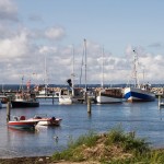 Hafen von Glowe<br>
Der Wasserwander-Rastplatz für 80-100 Boote wurde im Jahr 2000 neu eröffnet. Er liegt direkt am schönsten und längsten Sandstrand der Insel Rügen - der Schaabe, einer Nehrung von etwa 8 km Länge, die bis Breege / Juliusruh reicht. <br>
(Foto: Hafen von Glowe, © Irina Fischer  Fotolia.com) 